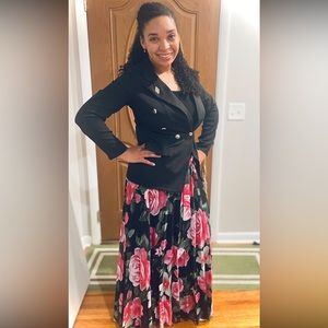 Floor length, sleeveless dress. The bottom is floral, top is black.